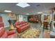 Finished basement features a bar, dining area, and living space with hardwood floors and ample lighting at 525 Hilliard Ct, Suwanee, GA 30024