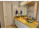 Bathroom featuring double sinks with modern vessel bowls and stylish fixtures at 525 Hilliard Ct, Suwanee, GA 30024