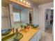 Bathroom featuring a large mirror and a double sink vanity at 525 Hilliard Ct, Suwanee, GA 30024
