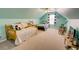 Spacious bedroom with ample natural light, vaulted ceilings and two comfortable beds, perfect for relaxing at 525 Hilliard Ct, Suwanee, GA 30024