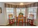 Cozy breakfast nook with natural light and comfortable seating at 525 Hilliard Ct, Suwanee, GA 30024