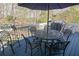 Cozy deck with patio furniture, ideal for outdoor dining or relaxation, with a view of the trees at 525 Hilliard Ct, Suwanee, GA 30024