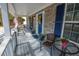 Charming front porch with comfortable seating, decorative accents, and a lovely view of the home's facade at 525 Hilliard Ct, Suwanee, GA 30024