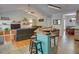 Open layout living room and kitchen with breakfast bar and ample seating at 525 Hilliard Ct, Suwanee, GA 30024