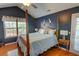 Cozy main bedroom featuring hardwood floors, natural light, and modern decor at 525 Hilliard Ct, Suwanee, GA 30024