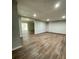 Spacious basement with a large open area, recessed lighting, and wood-look floors at 1110 Toonigh Rd, Canton, GA 30115