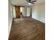 Spacious bedroom featuring barn door, wood-look floors, and ample natural light at 1110 Toonigh Rd, Canton, GA 30115