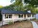 Charming renovated ranch-style home with a welcoming front porch and freshly landscaped yard at 1110 Toonigh Rd, Canton, GA 30115