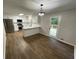 Open concept kitchen and dining area with stainless steel appliances and access to the deck at 1110 Toonigh Rd, Canton, GA 30115