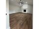 Spacious living room with wood-look flooring, a stone fireplace, and a ceiling fan at 1110 Toonigh Rd, Canton, GA 30115