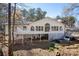 A charming home's back exterior, featuring a hot tub and an open space beneath the house at 116 Myrtle Rd, Woodstock, GA 30189