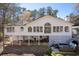 A charming home's back exterior, featuring a hot tub and an open space beneath the house at 116 Myrtle Rd, Woodstock, GA 30189