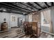 Basement bar area with wood bar, brick accent wall, and seating, perfect for entertaining at 116 Myrtle Rd, Woodstock, GA 30189