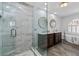 Beautiful bathroom with a glass walk-in shower, double vanity, and soaking tub next to a window at 116 Myrtle Rd, Woodstock, GA 30189