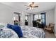 Comfortable bedroom area with natural light, a ceiling fan, and adjacent study/office space at 116 Myrtle Rd, Woodstock, GA 30189