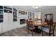 Open dining room with custom bookshelves, a fireplace, and new wood flooring at 116 Myrtle Rd, Woodstock, GA 30189