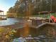 Waterfront home featuring a private dock with boat, offering stunning lake views and access at 116 Myrtle Rd, Woodstock, GA 30189