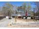Traditional home featuring a neatly manicured yard, American flag, golf cart, boat, and white picket fence at 116 Myrtle Rd, Woodstock, GA 30189