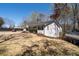 Exterior side view with a boat and room for a golf cart on a well-maintained lawn and a home with dark trim at 116 Myrtle Rd, Woodstock, GA 30189