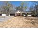Charming single-Gathering home with a well-manicured lawn, an attached garage, and a cozy front porch at 116 Myrtle Rd, Woodstock, GA 30189