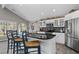 Modern kitchen with granite countertops, stainless steel appliances, and an eat-in island at 116 Myrtle Rd, Woodstock, GA 30189