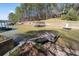 Picturesque waterfront featuring private docks on a serene lake, surrounded by lush trees at 116 Myrtle Rd, Woodstock, GA 30189