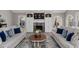 Charming living room with a fireplace, custom cabinetry, and abundant natural light from large windows at 116 Myrtle Rd, Woodstock, GA 30189