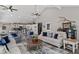Inviting living room with vaulted ceilings, wood accents, and a view to the kitchen at 116 Myrtle Rd, Woodstock, GA 30189