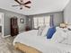 Main bedroom features wood-look floors, neutral paint, natural light, and ample space at 116 Myrtle Rd, Woodstock, GA 30189
