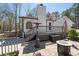 Outdoor patio with stone pavers, fire pit, and exterior stairs at 116 Myrtle Rd, Woodstock, GA 30189