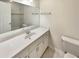 Clean bathroom with white vanity, large mirror, and updated fixtures at 1336 Candlelite Ln, Snellville, GA 30078
