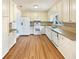 Spacious kitchen with white cabinets, granite countertops, and stainless steel appliances at 1336 Candlelite Ln, Snellville, GA 30078