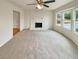 Bright living room featuring a stone fireplace and bay window at 1336 Candlelite Ln, Snellville, GA 30078