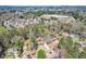 Great aerial view of the property and surrounding neighborhood in a wooded setting at 1564 Pedro Sw Dr, Mableton, GA 30126