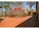 Expansive wooden deck overlooking lush backyard with mature trees and shrubs at 1564 Pedro Sw Dr, Mableton, GA 30126