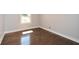 Cozy bedroom features hardwood floors, natural light, and neutral wall paint at 1564 Pedro Sw Dr, Mableton, GA 30126