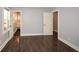 Spacious bedroom features hardwood flooring and a glimpse into an adjacent bathroom at 1564 Pedro Sw Dr, Mableton, GA 30126