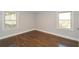 Bright bedroom with hardwood floors and two windows providing natural light at 1564 Pedro Sw Dr, Mableton, GA 30126