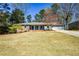 Lovely single-story home with a manicured lawn and integrated two-car garage at 1564 Pedro Sw Dr, Mableton, GA 30126