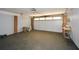 Attached garage featuring clean design and tiled floor with exposed brick accent wall at 1564 Pedro Sw Dr, Mableton, GA 30126