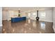 Open-concept living room with hardwood floors and gourmet kitchen with large island at 1564 Pedro Sw Dr, Mableton, GA 30126