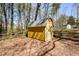 Outdoor storage shed in backyard featuring neutral siding and trim, perfect for storage at 1564 Pedro Sw Dr, Mableton, GA 30126