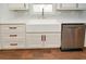 Farmhouse style kitchen sink with stainless steel dishwasher and quartz countertop at 1564 Pedro Sw Dr, Mableton, GA 30126