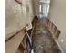 Hallway of a home undergoing renovations with exposed studs at 2863 Windsor Forrest Ct, Atlanta, GA 30349