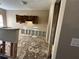 Kitchen undergoing renovations with open cabinets and bar area at 2863 Windsor Forrest Ct, Atlanta, GA 30349
