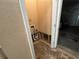Bare room undergoing renovations next to a garage at 2863 Windsor Forrest Ct, Atlanta, GA 30349