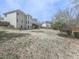 Extensive backyard with faded lawn and a two-story home featuring a deck, ideal for relaxation at 3891 Greensward Nw Vw, Kennesaw, GA 30144