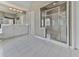 Bathroom with large shower stall, tiled floors, and ample cabinet space at 3891 Greensward Nw Vw, Kennesaw, GA 30144