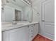 Modern bathroom with double vanity, white cabinetry, and a large mirror, exuding a clean and contemporary design at 3891 Greensward Nw Vw, Kennesaw, GA 30144