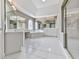 Bright, spacious bathroom with large mirrors, a soaking tub, dual vanities, and a separate glass-enclosed shower at 3891 Greensward Nw Vw, Kennesaw, GA 30144